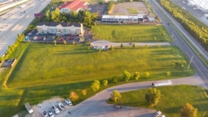 Image of grass and street with homes